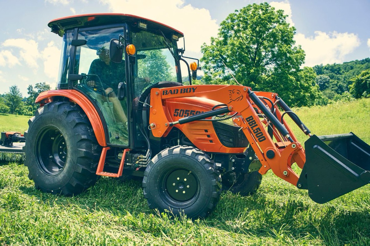Bad Boy 5055 tractor with BBL500 loader mowing a field